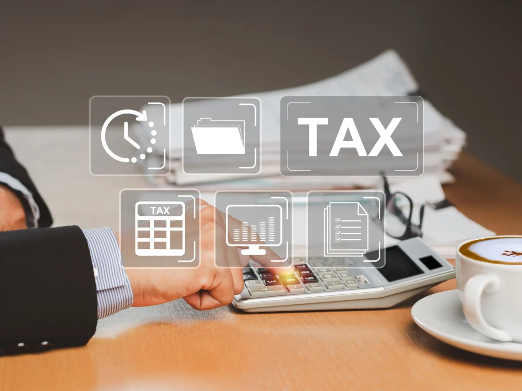 tax day concept a businessman uses a calculator to calculate taxes while sitting in the office photo 1